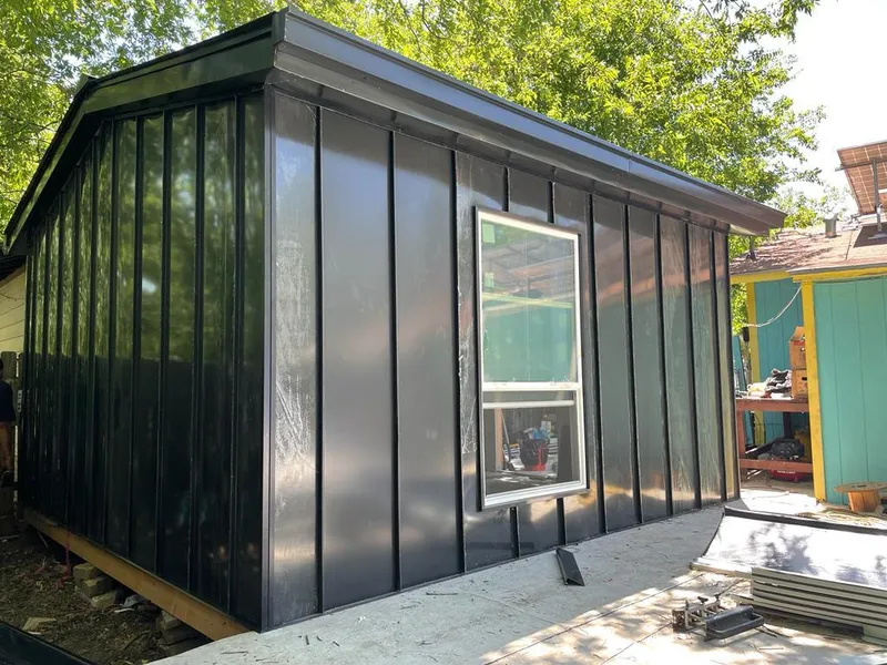 Black standing seam metal wall panels for Roof Inspection in La Grande