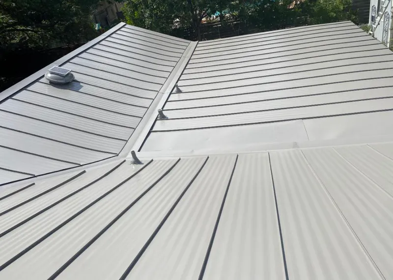 Solar attic fan installed on a metal roof for Roof Ventilation in La Grande